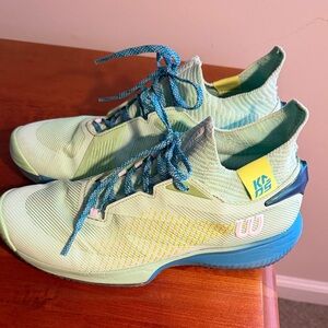 Wilson Mint Green Tennis Shoes with Blue Laces and Yellow Accents pre owned. 9.5